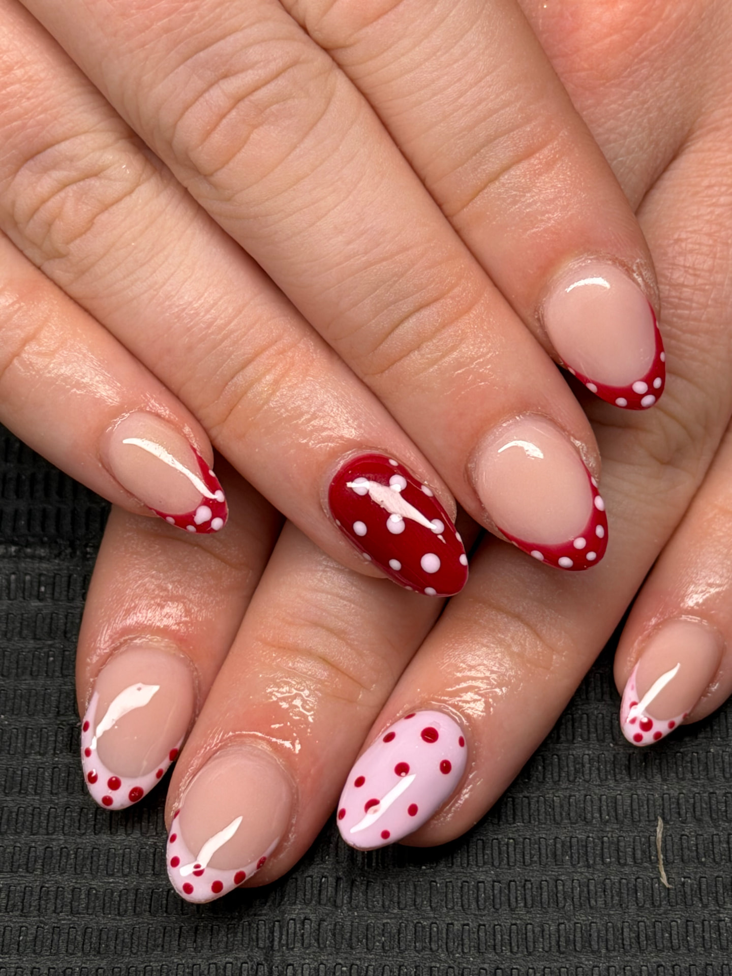 Red and pink polka-dot French nail art by Serin