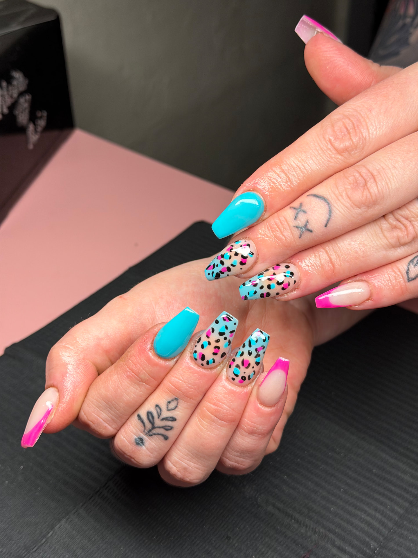 Turquoise and pink confetti nail art by Serin