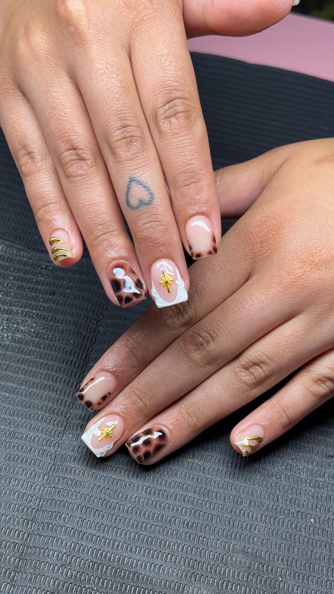 Leopard and gold accent nail art by Serin